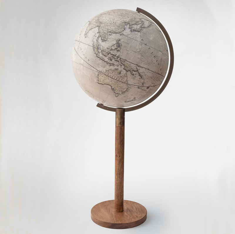 A large 19" globe that looks old but has up to date cartography. A brass arm and hardwood stem.